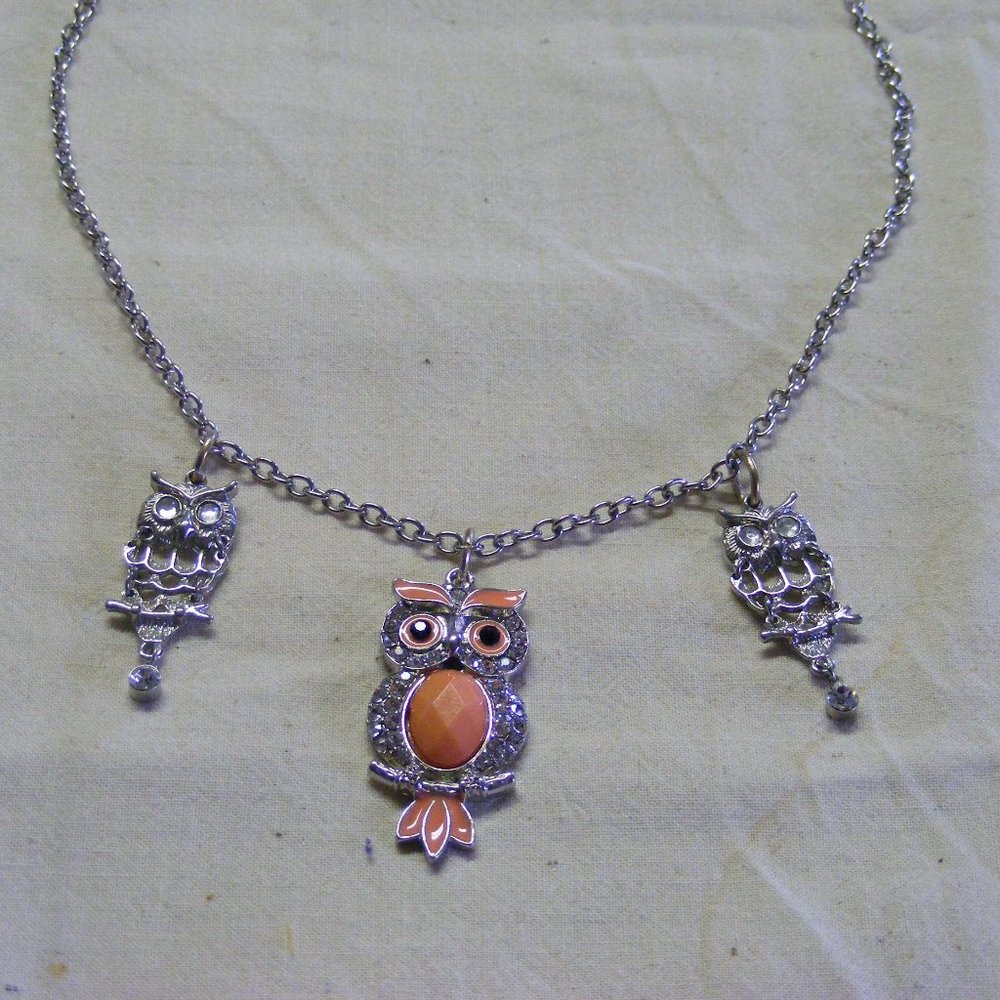 Trio of Owls handing out on a chain